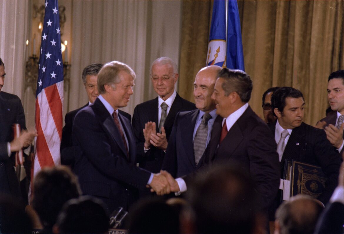 Jimmy Carter and General Omar Torrijos shake hands after signing the Panama Canal Treaty in the Pan American Union Building, Washington, September 7, 1977
