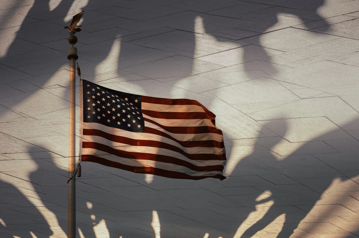 Shadows of people and the American flag, conceptual photography
