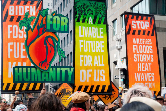 Four large banners at March to End Fossil Fuels