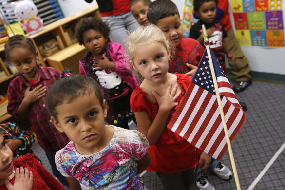 Children recite the Pledge of Allegiance at the beginning of the school day at the federally-funded Head Start school in Woodbourne, N.Y., on Sept. 20, 2012. 